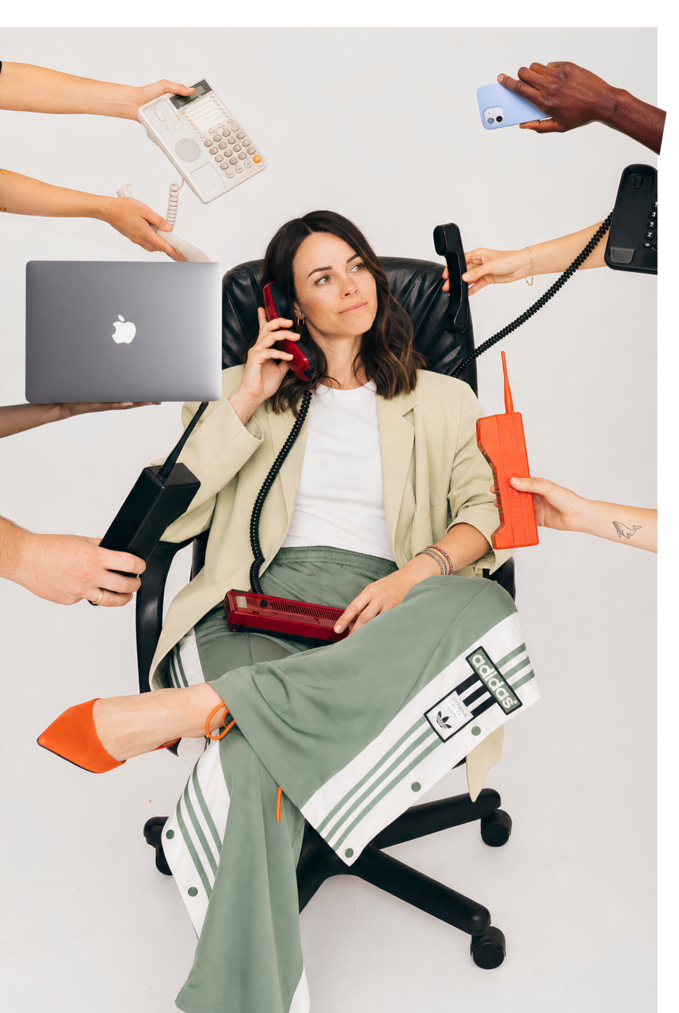 Nadina seated in a chair surrounded by competing demands